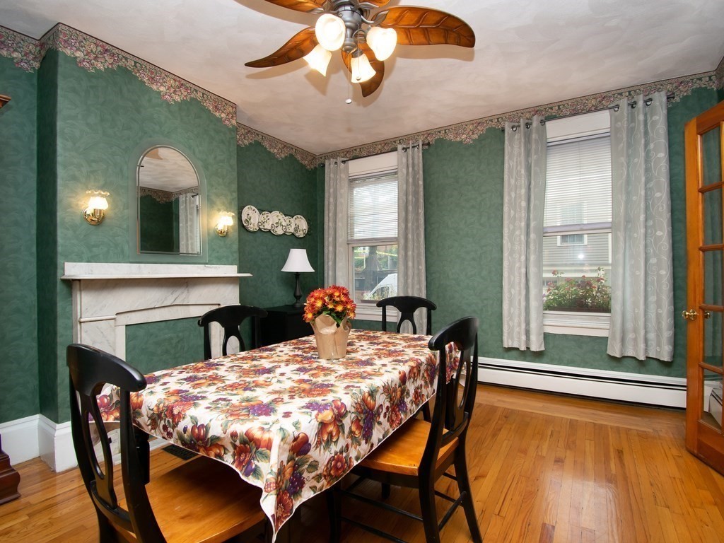 100 Elm Street Boston, MA 02129 - Photo 10 of 18 a view of a dining room with furniture window and wooden floor
