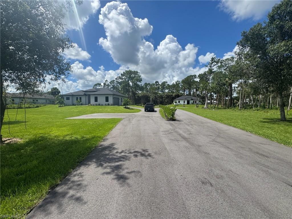 308 Golden Gate Boulevard East Naples, FL 34117 - Photo 2 of 29 a view of a park with large trees