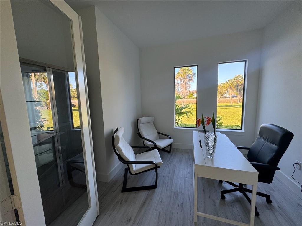 308 Golden Gate Boulevard East Naples, FL 34117 - Photo 21 of 29 a living room with furniture and a window