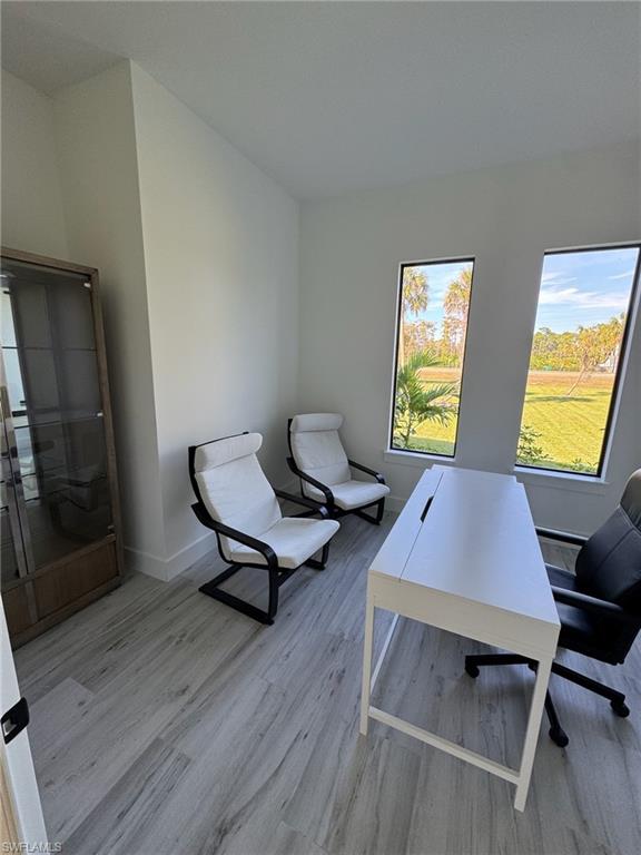 308 Golden Gate Boulevard East Naples, FL 34117 - Photo 22 of 29 a room with furniture and window