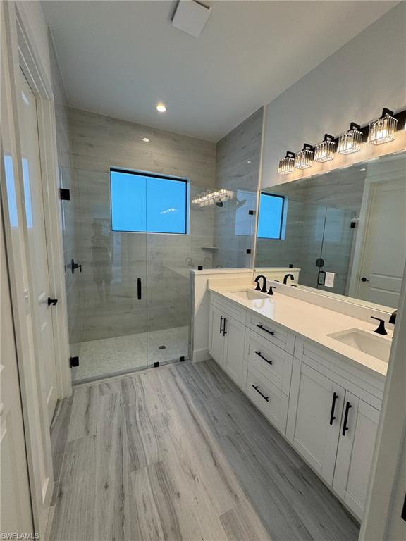 308 Golden Gate Boulevard East Naples, FL 34117 - Photo 23 of 29 a view of bathroom with dual sinks