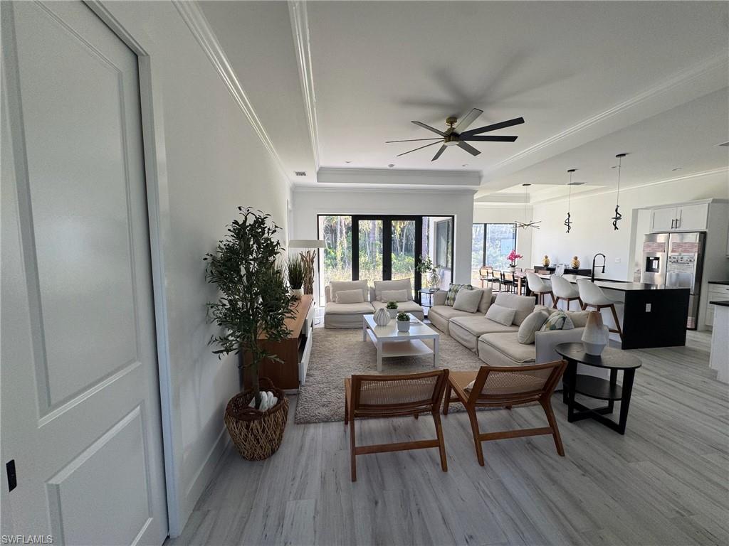 308 Golden Gate Boulevard East Naples, FL 34117 - Photo 5 of 29 a living room with furniture