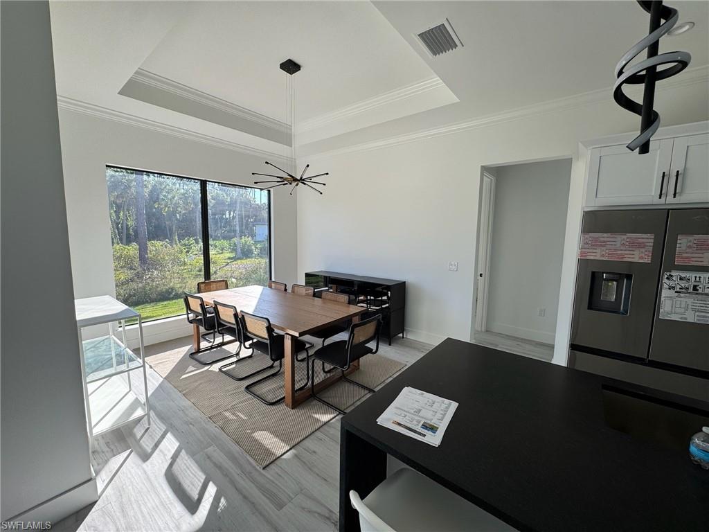 308 Golden Gate Boulevard East Naples, FL 34117 - Photo 10 of 29 a view of a workspace with furniture and a window