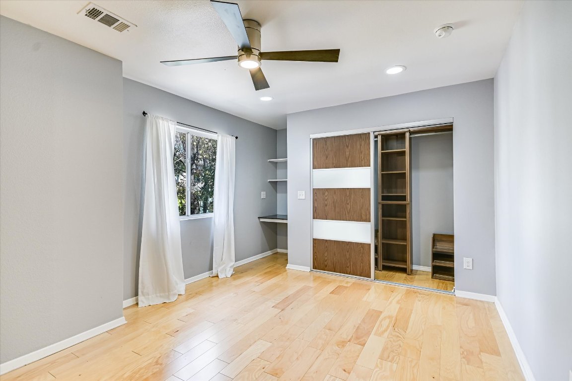 1193 Curve Street Austin, TX 78702 - Photo 11 of 18 a bedroom with a bed and a window