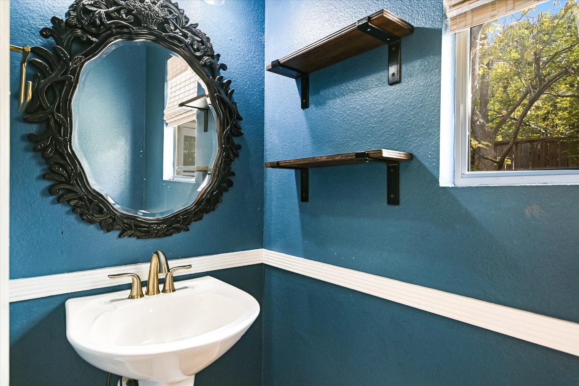 1193 Curve Street Austin, TX 78702 - Photo 14 of 18 a bathroom with a sink and a mirror