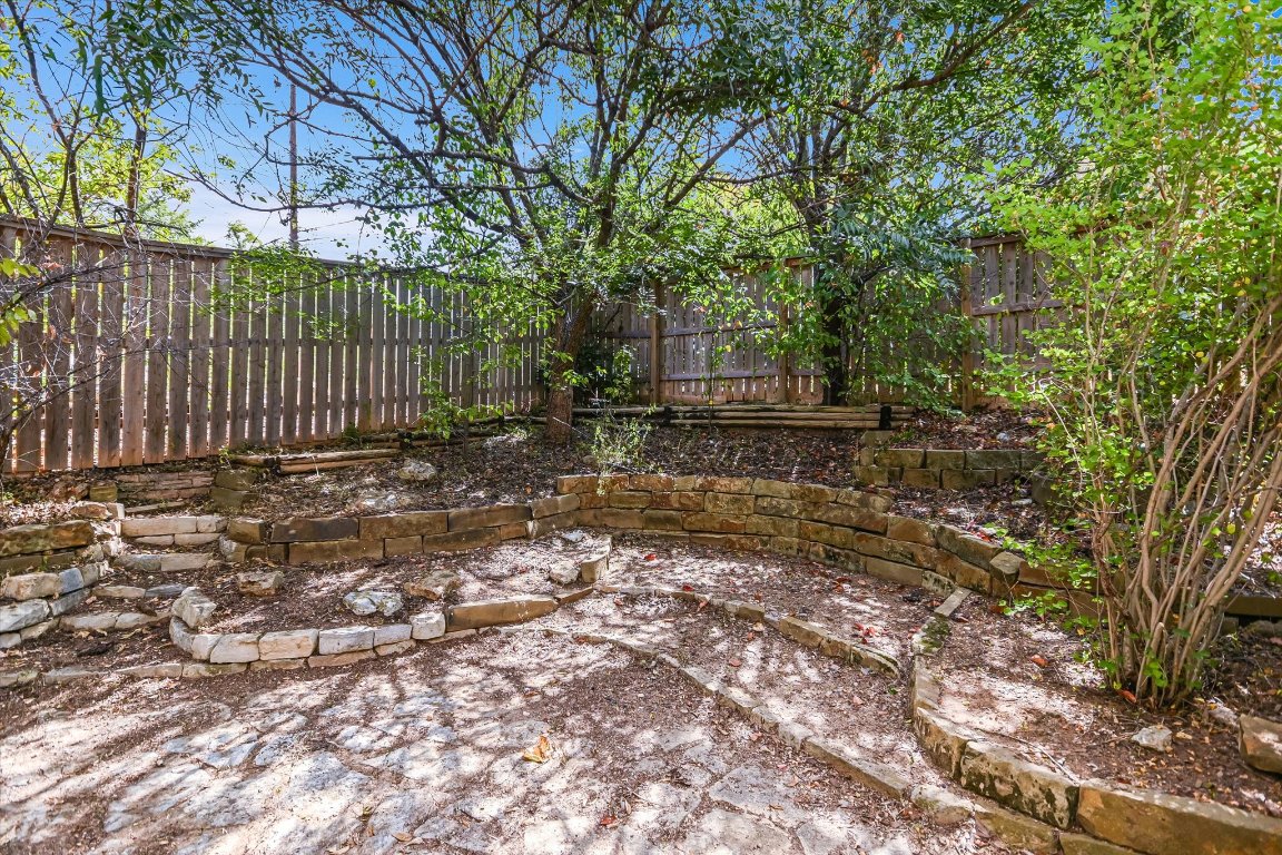 1193 Curve Street Austin, TX 78702 - Photo 15 of 18 a view of a backyard with large trees