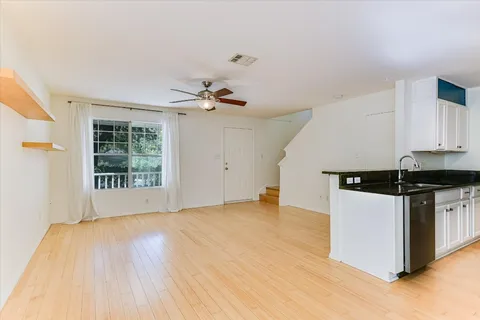a kitchen with a stove and a white cabinets