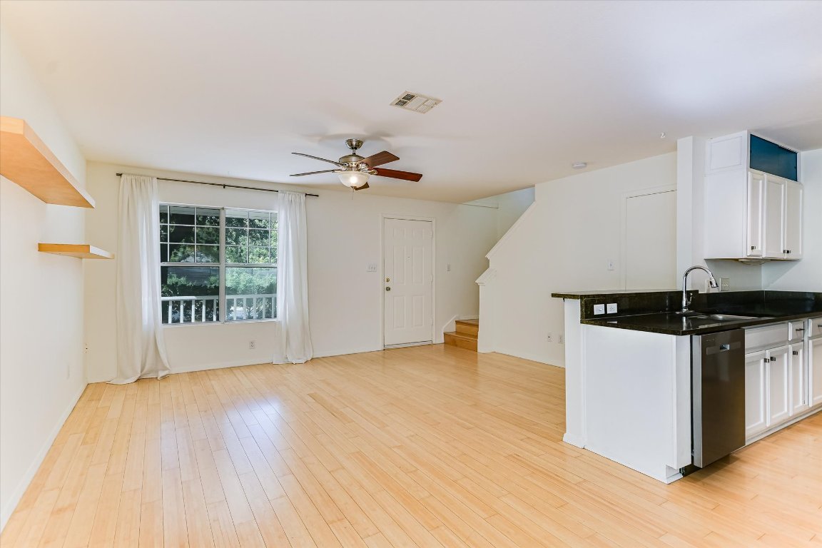 1193 Curve Street Austin, TX 78702 - Photo 3 of 18 a kitchen with a stove and a white cabinets