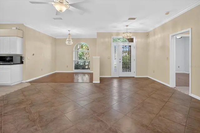 a large kitchen with stainless steel appliances kitchen island granite countertop a stove a sink dishwasher and a refrigerator