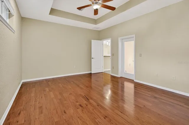 an empty room with closet and a bathroom