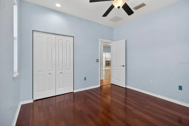 a view of a house with a patio and a yard