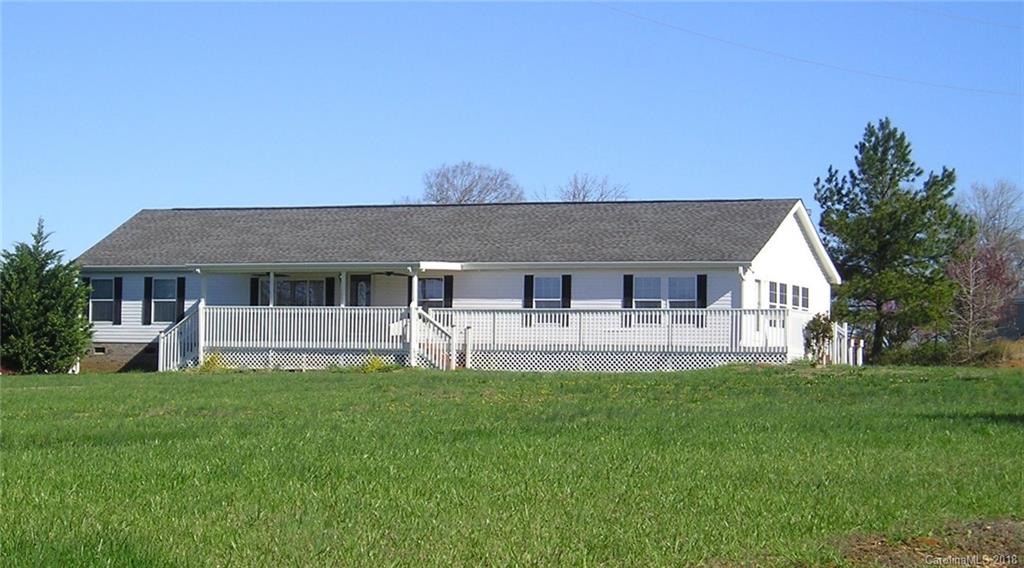 4737 White Store Road Wingate, NC 28174 - Photo 1 of 36 a front view of house with a garden