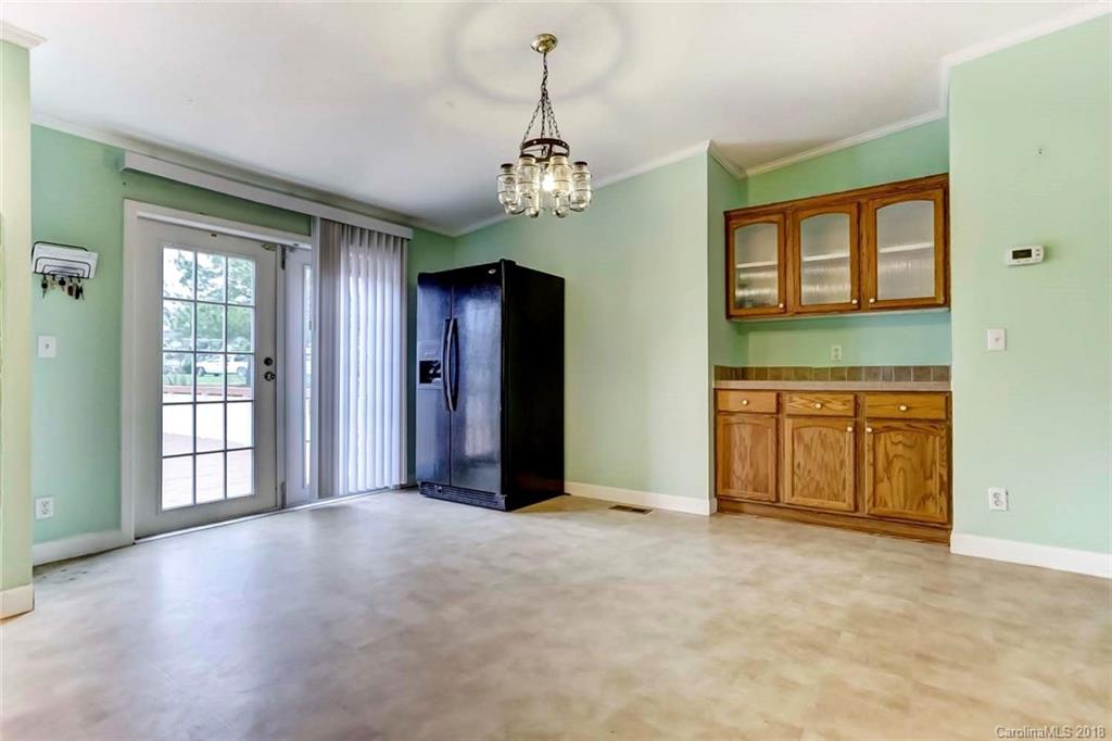 4737 White Store Road Wingate, NC 28174 - Photo 12 of 36 wooden floor in an empty room with a window
