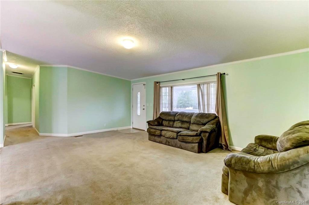 4737 White Store Road Wingate, NC 28174 - Photo 13 of 36 a living room with furniture and a window