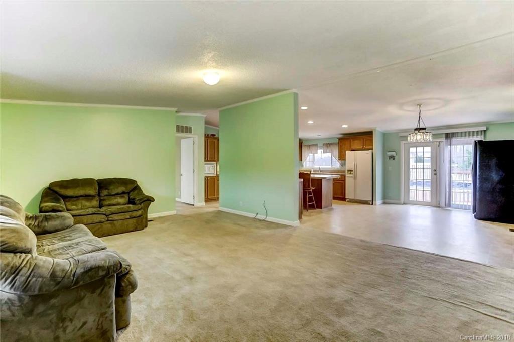 4737 White Store Road Wingate, NC 28174 - Photo 15 of 36 a view of a livingroom with furniture and wooden floor