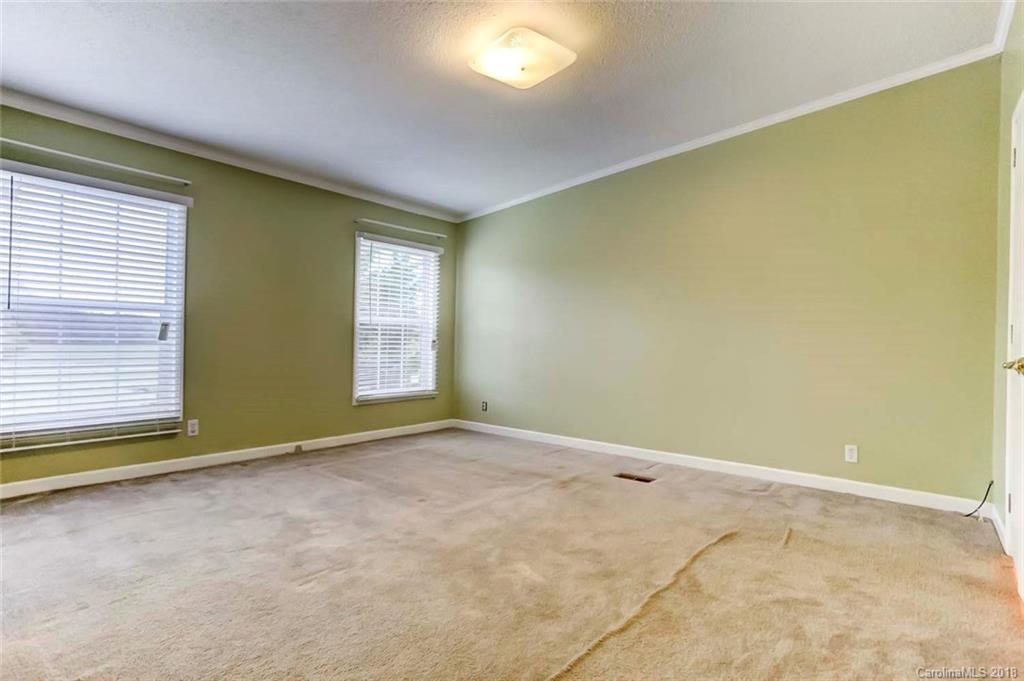 4737 White Store Road Wingate, NC 28174 - Photo 17 of 36 an empty room with windows