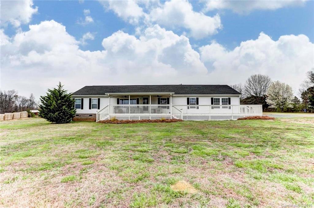 4737 White Store Road Wingate, NC 28174 - Photo 3 of 36 a front view of a house with garden