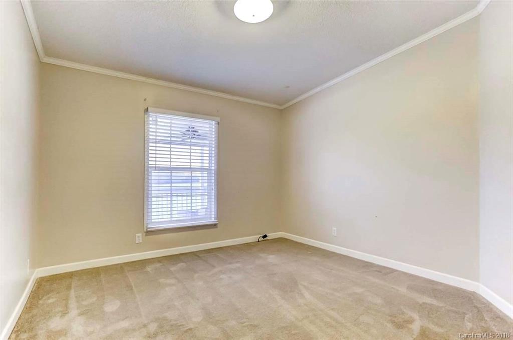 4737 White Store Road Wingate, NC 28174 - Photo 22 of 36 an empty room with windows