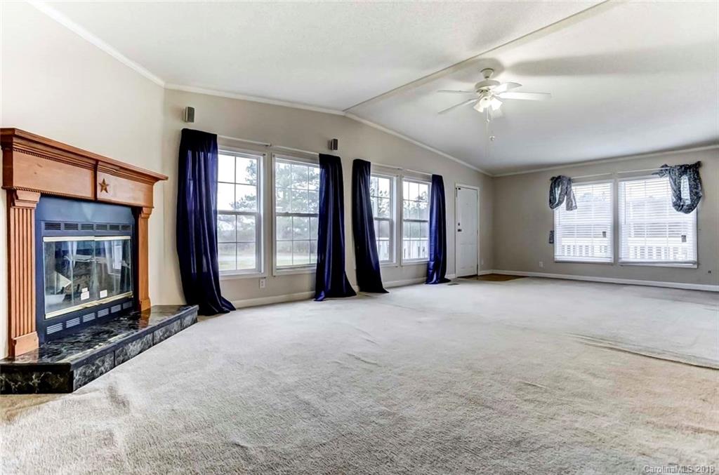 4737 White Store Road Wingate, NC 28174 - Photo 23 of 36 a view of an empty room with large windows