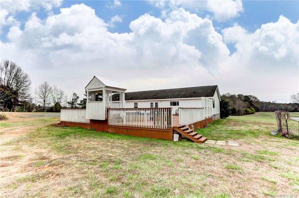 4737 White Store Road Wingate, NC 28174 - Photo 29 of 36 a view of a house with backyard and sitting area