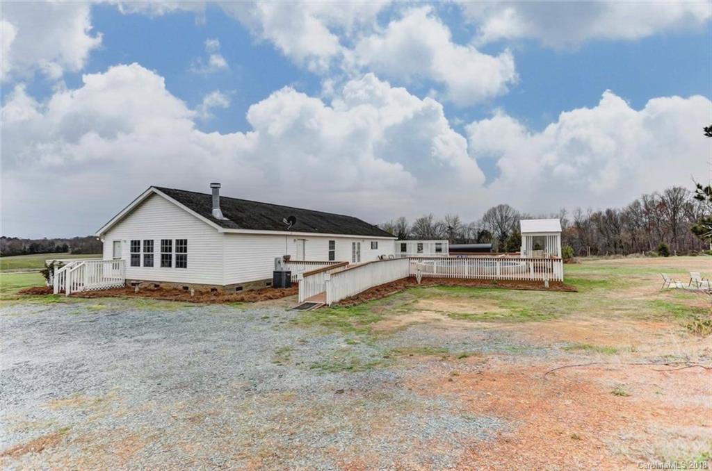 4737 White Store Road Wingate, NC 28174 - Photo 31 of 36 a view of a house with a yard and fence