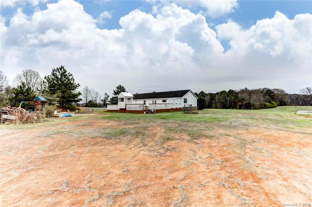4737 White Store Road Wingate, NC 28174 - Photo 32 of 36 a view of swimming pool is sitting in the middle of a yard