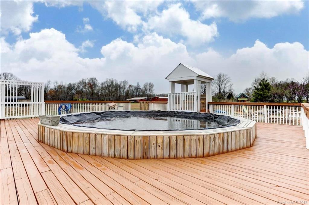 4737 White Store Road Wingate, NC 28174 - Photo 34 of 36 a view of a house with wooden deck