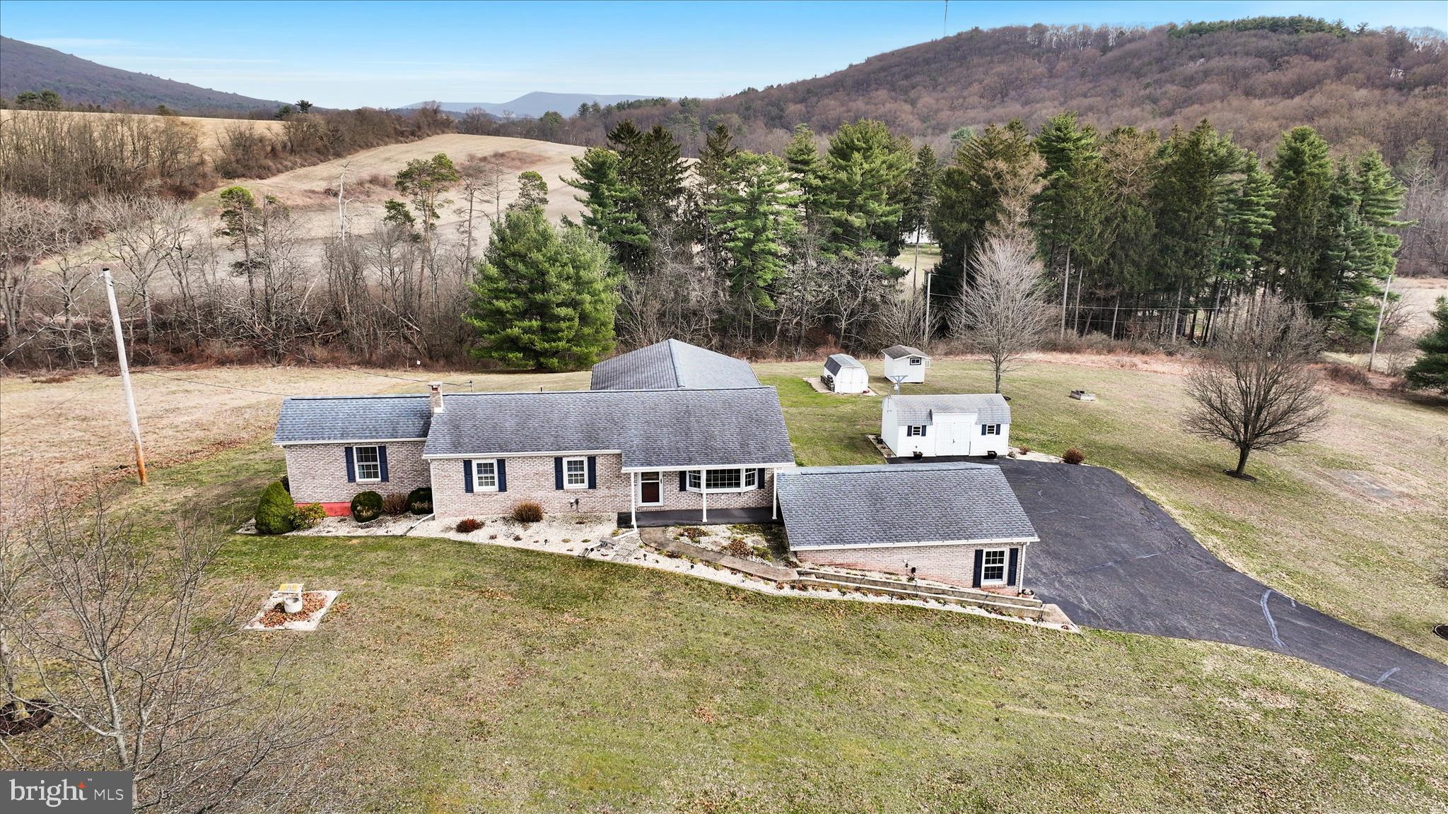 3 Coleman Road Hegins, PA 17938 - Photo 1 of 52 an aerial view of a house with a garden and mountain view