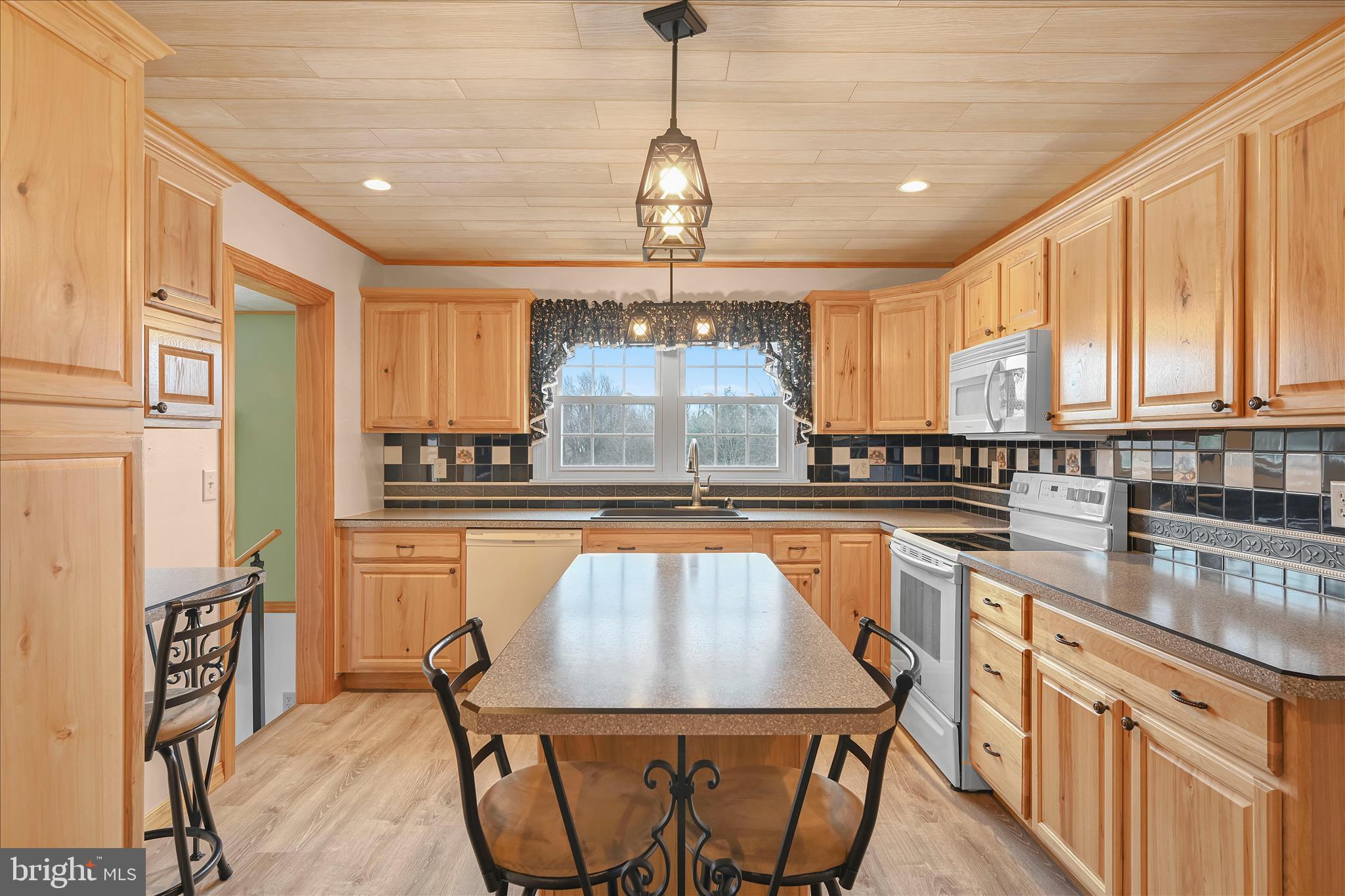 3 Coleman Road Hegins, PA 17938 - Photo 25 of 52 a kitchen with stainless steel appliances granite countertop a sink a stove cabinets counter space and a window