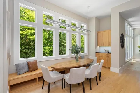 a view of a dining room with furniture window and outside view