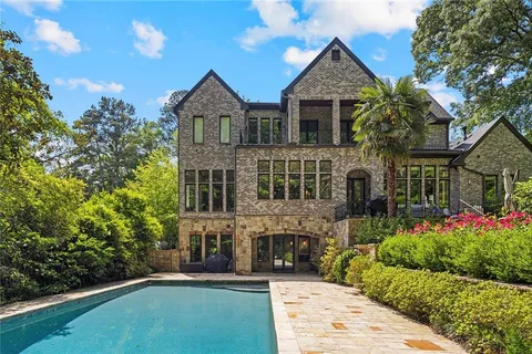 an aerial view of house with yard swimming pool and outdoor seating
