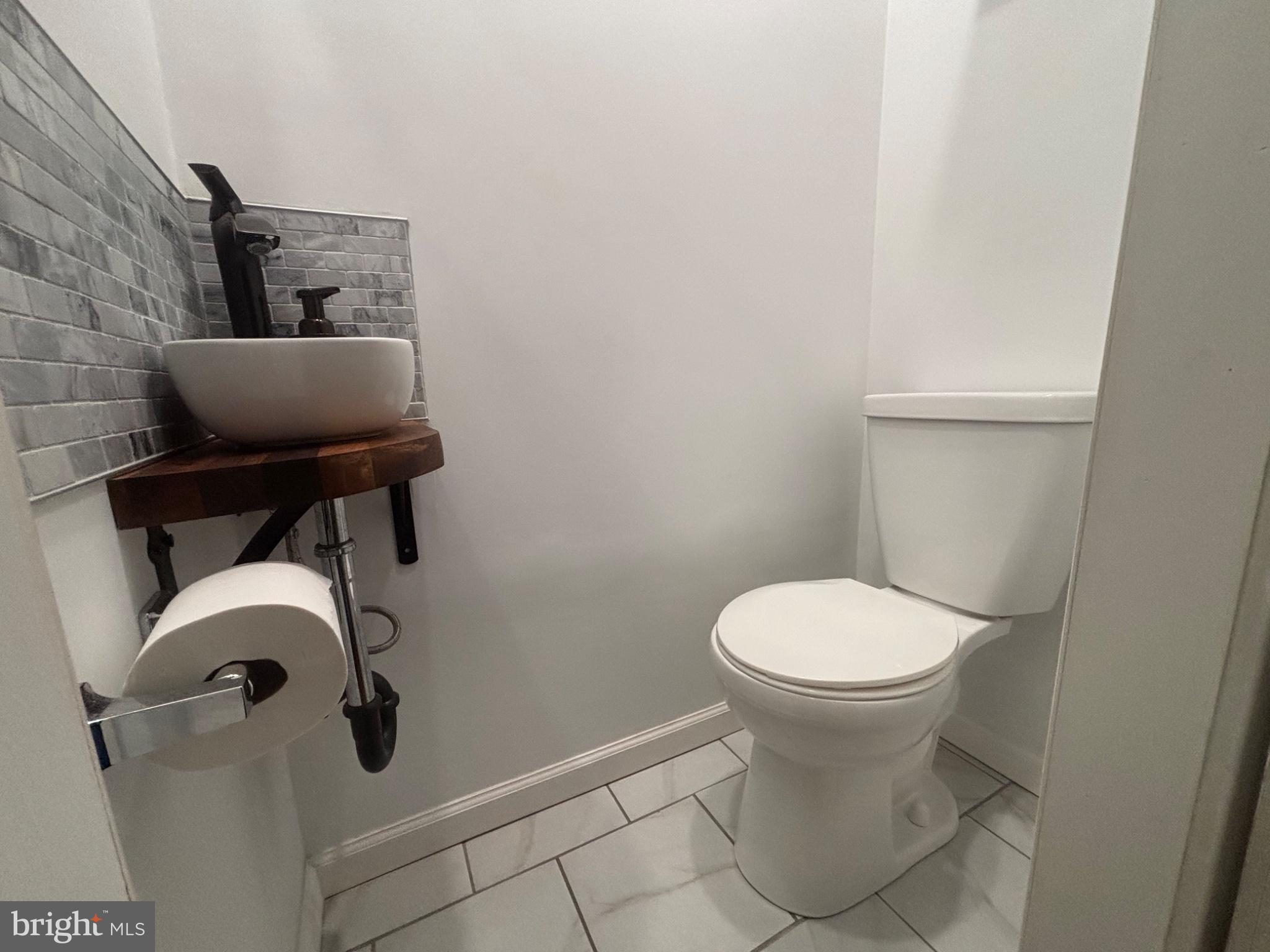 4101 Vernon Road Drexel Hill, PA 19026 - Photo 7 of 26 Sleek and modern powder room design.