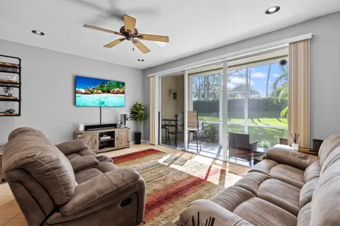 a view of a room with a furniture and floor to ceiling window