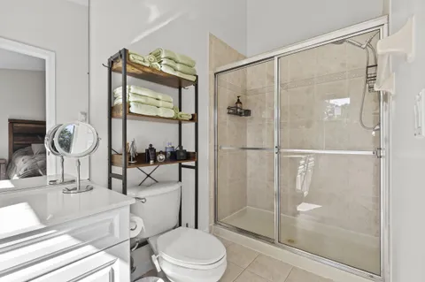 a living room with lots of furniture and clutter