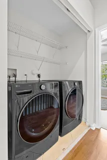 a living room with furniture potted plant and a table
