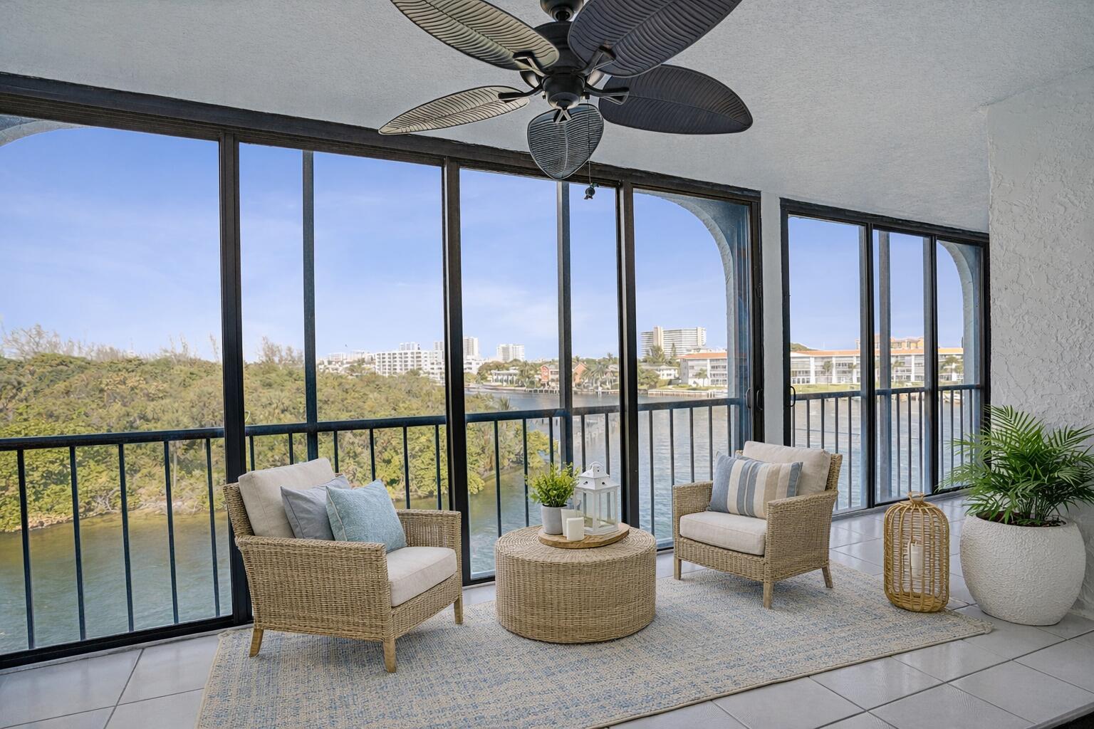a living room with furniture and a potted plant