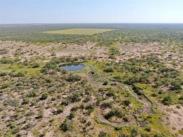 an aerial view of beach and ocean