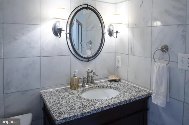 a spacious bedroom with a bed and a fireplace