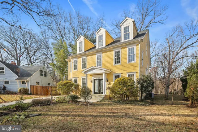 a front view of residential houses with yard