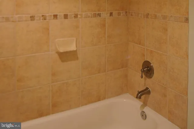 a view of a a dining room with furniture window and wooden floor