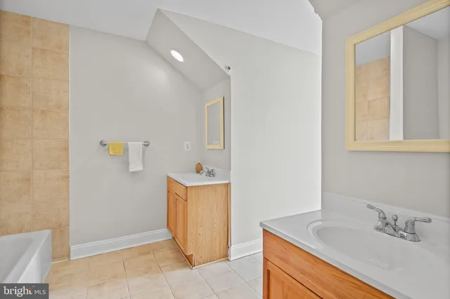 a bathroom with a bathtub and toilet