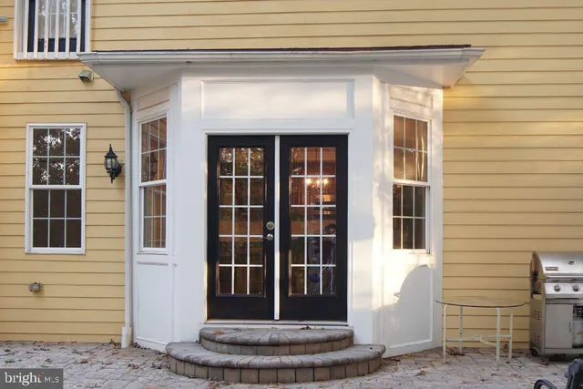 a view of a house with a yard and tree s