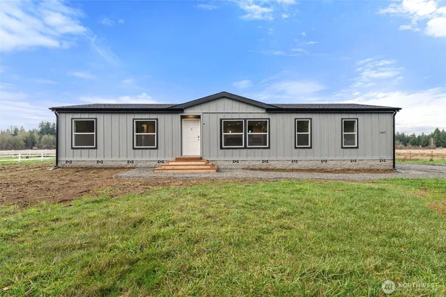 a front view of a house with yard