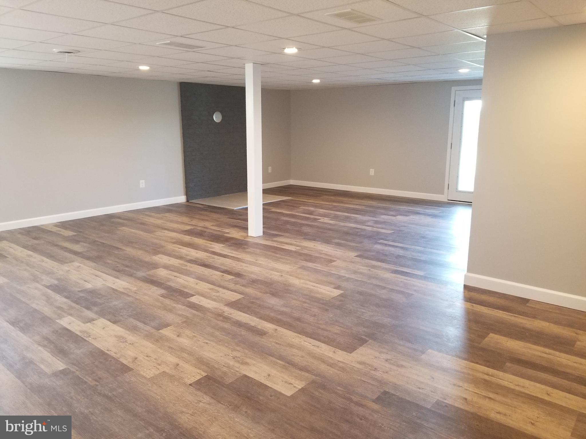 1222 Bachmans Valley Road Westminster, MD 21158 - Photo 42 of 61 Lower level rec room w/ hearth