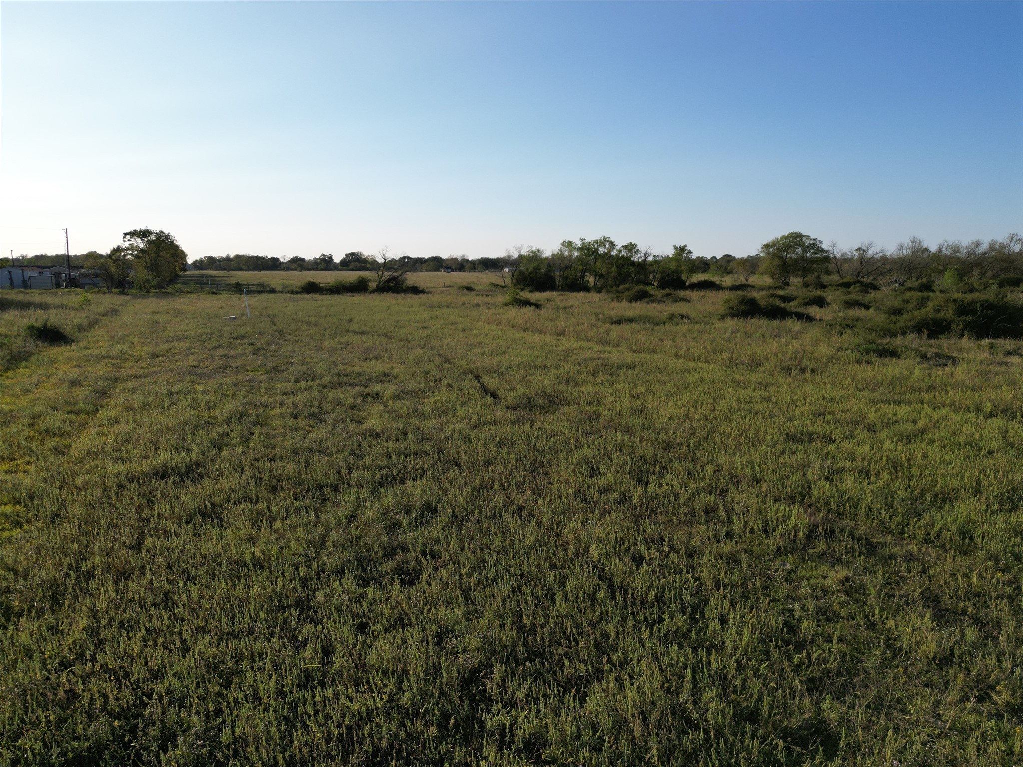 0 County Road 220 Angleton, TX 77515 - Photo 18 of 22 a view of a lake with houses in back