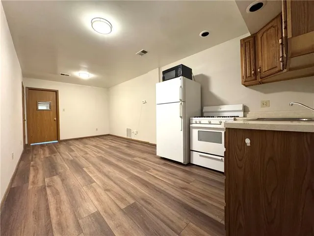 a kitchen with a sink and a stove top oven