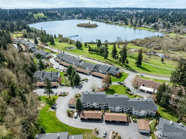 an aerial view of a house with a lake view