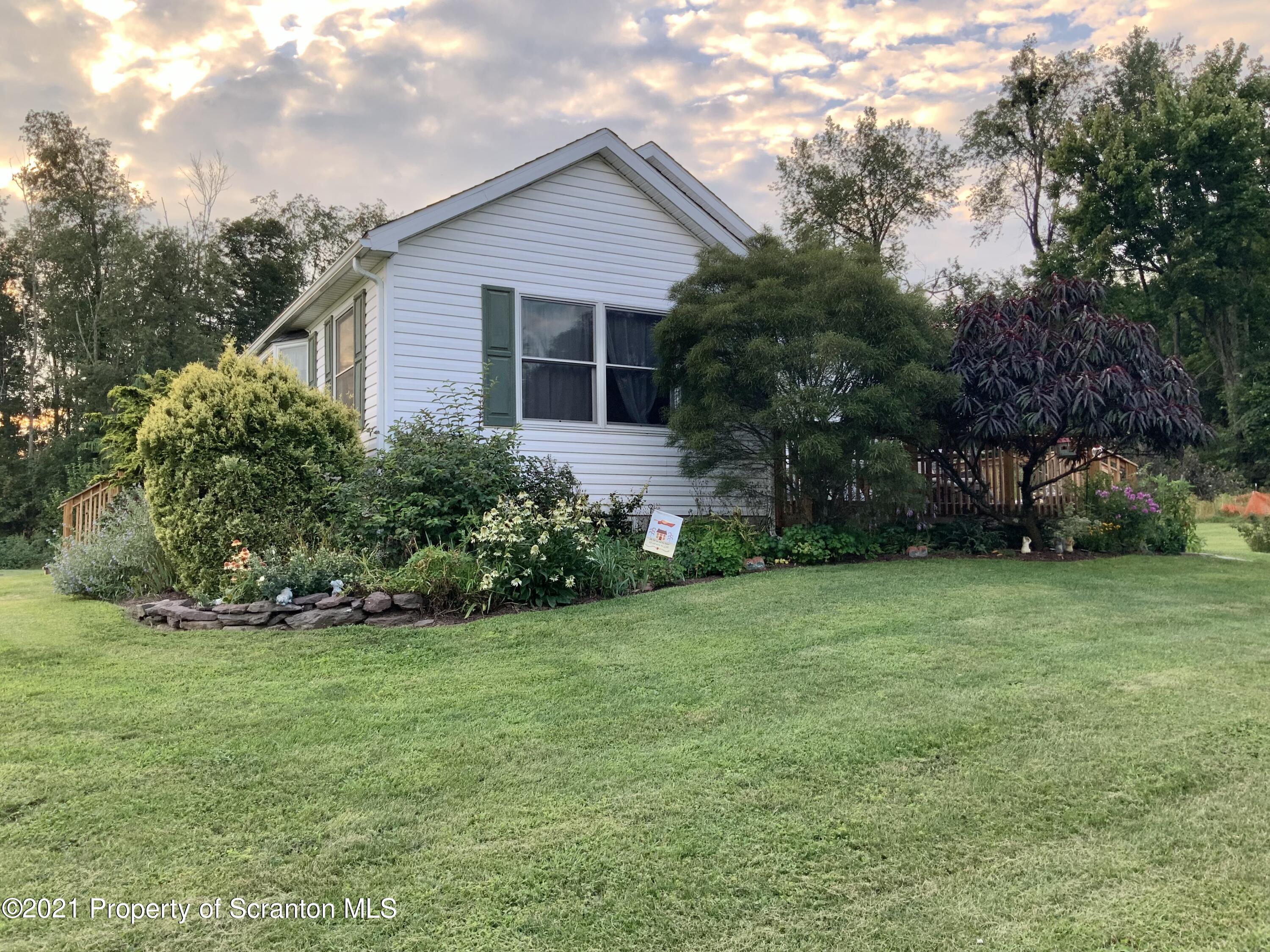 647 Bennett Road Meshoppen, PA 18630 - Photo 2 of 35 a front view of house with yard and green space