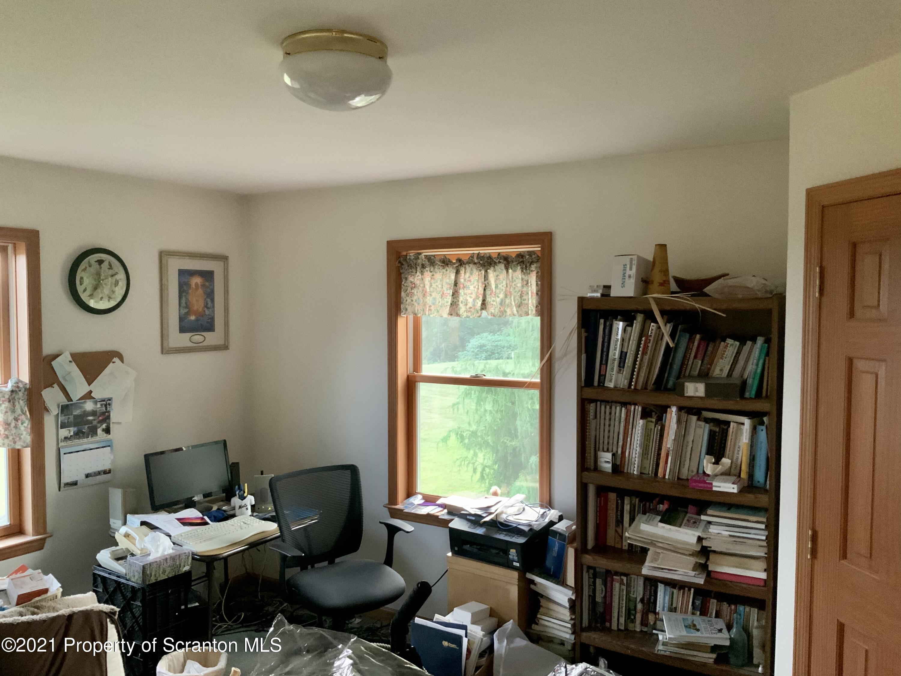 647 Bennett Road Meshoppen, PA 18630 - Photo 23 of 35 a living room with furniture and a window