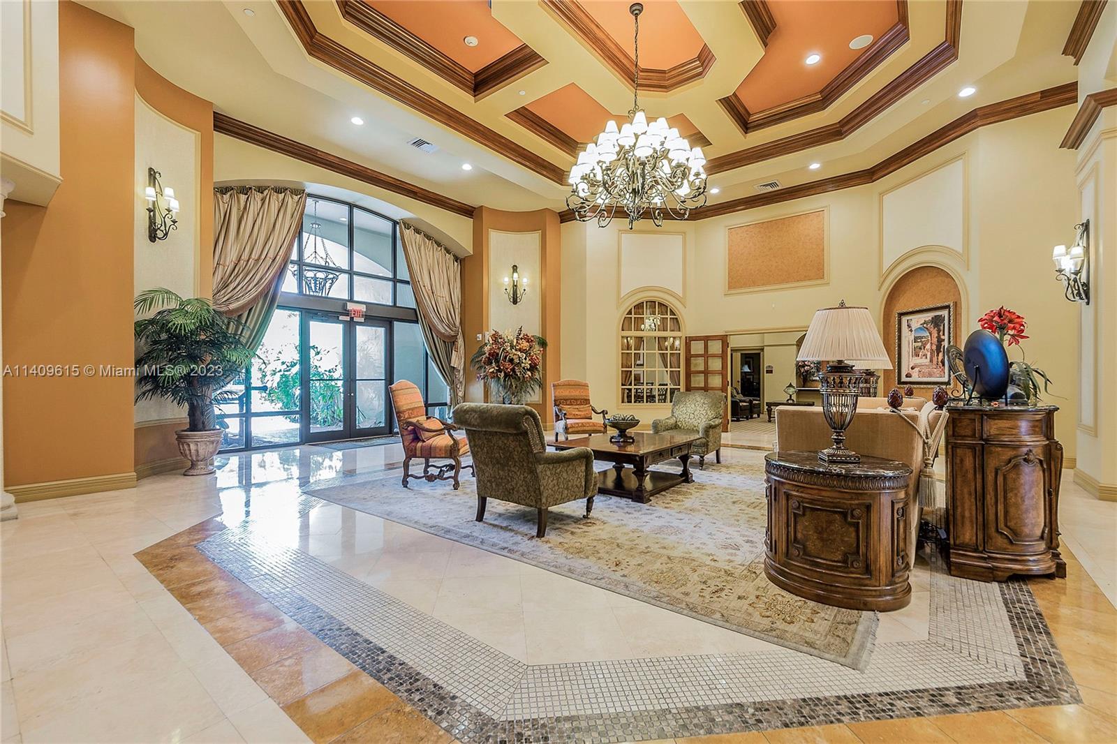 888 Douglas Road, Unit 1407 Coral Gables, FL 33134 - Photo 3 of 11 a living room with fireplace furniture and a chandelier